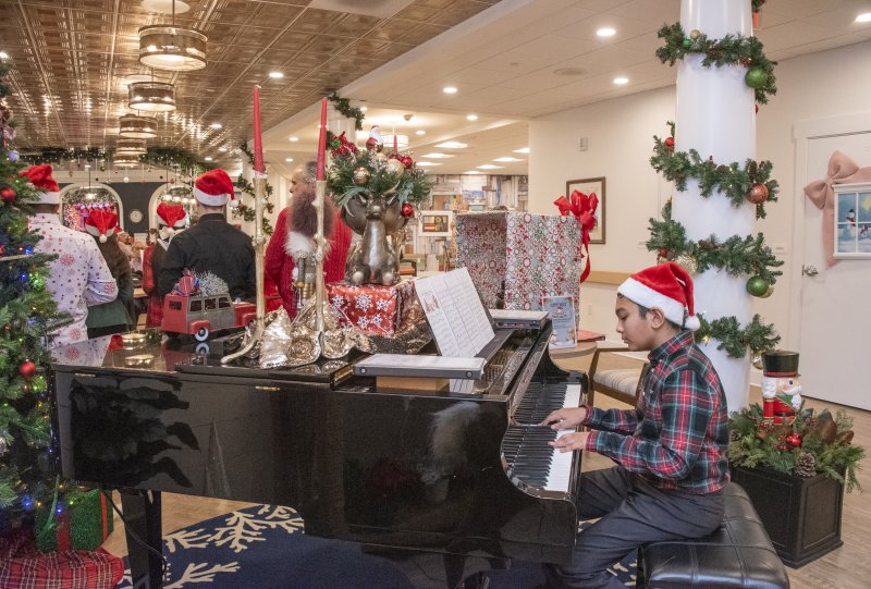 The Lodge at Historic Lewes hosts carolers serenading the residents.